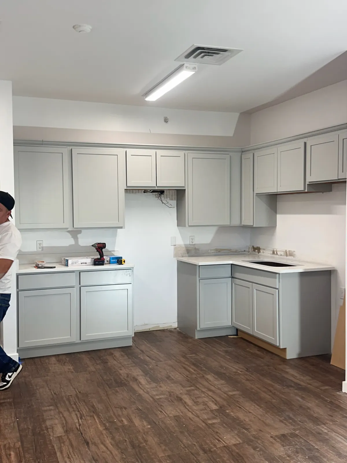 Kitchen with new cabinets, quartz countertops, and flooring at Green Senior Living Seward