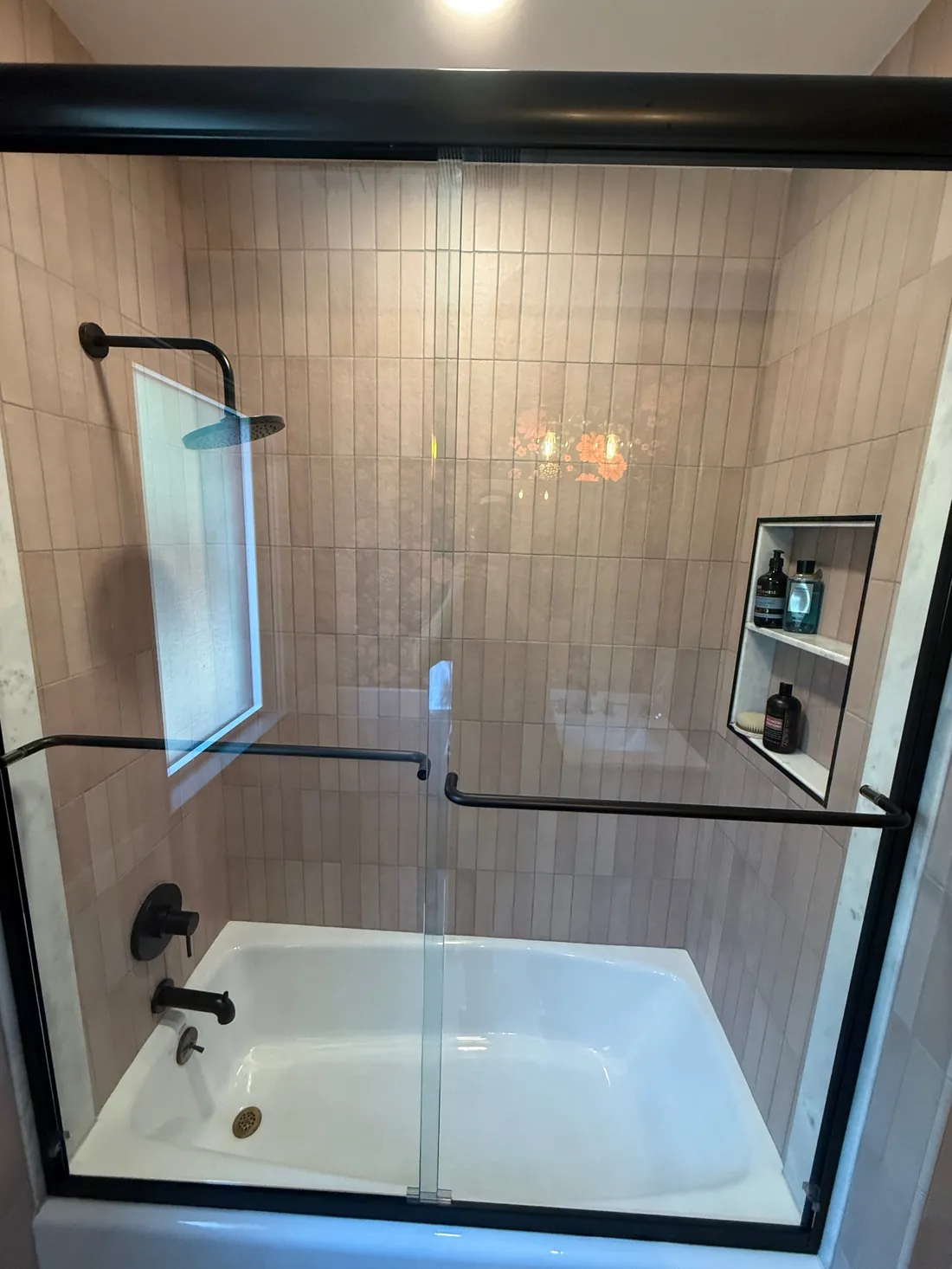 Tub shower with custom tile and niches
